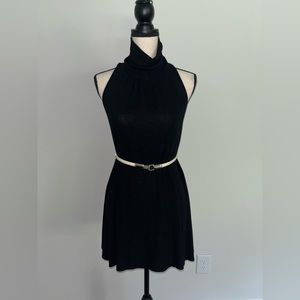 Beautiful black flowy mock turtleneck cocktail dress with a bit of shimmer